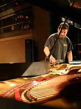 Franco Skilan tuning a concert grand piano