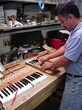 Rebushing piano keys to restore pianos