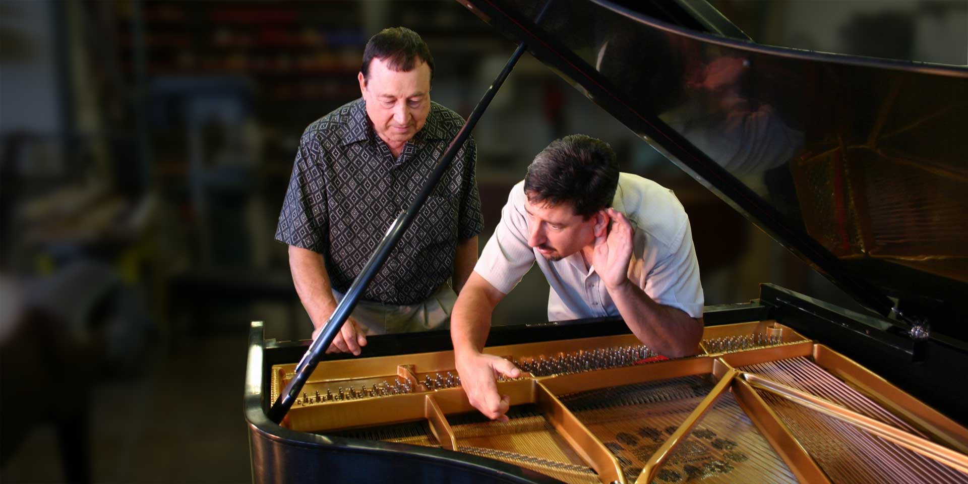 Franco and his late father Giovanni testing sound on a grand piano