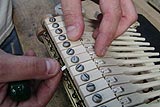 Enlarge this image Traveling the piano hammershank during a piano restoration