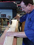 Drilling piano pinblock as part of grand piano restoration