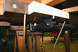 Rebuilt pedal component on the Wurlitzer Butterfly Baby Grand Piano