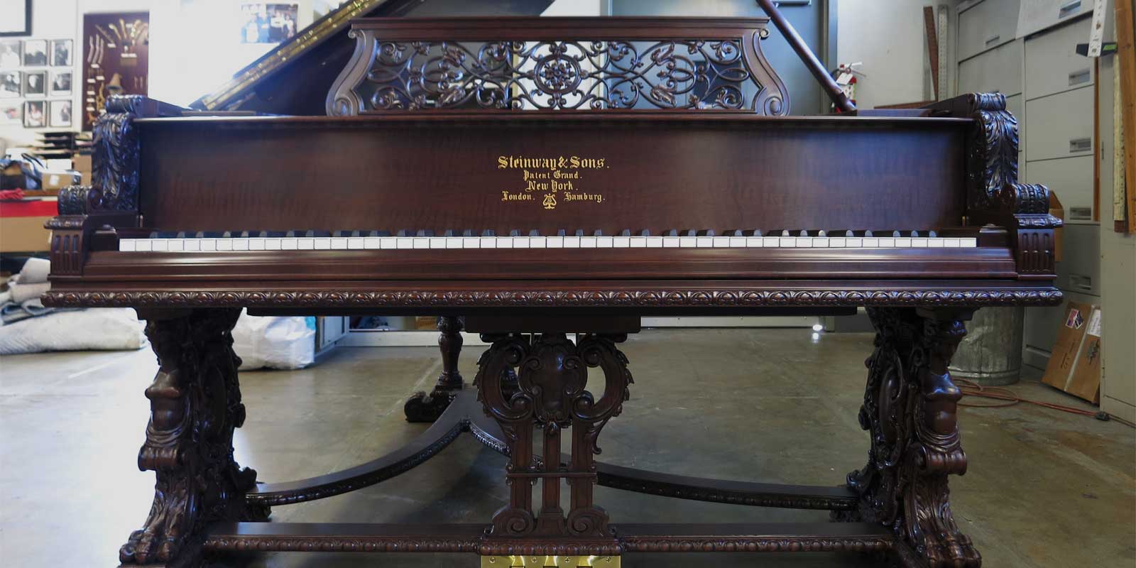 Intricately carved Steinway and Sons grand piano