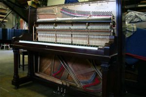Kurtzmann upright grand piano open showing restored action components