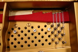 Close-up of vintage Mason and Hamlin grand piano for restrining