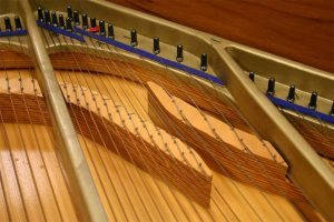 Close-up view inside restored hybrid piano