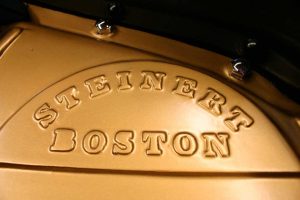 Embossed Steinert grand piano emblem