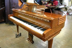 Wurlitzer Butterfly baby grand piano in for restringing and action components