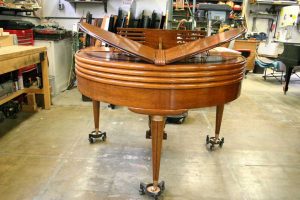 Back of Wurlitzer Butterfly baby grand piano brought in for restoration