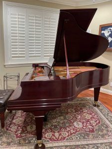 Iva's fully restored Mason and Hamlin Model A grand piano in her home