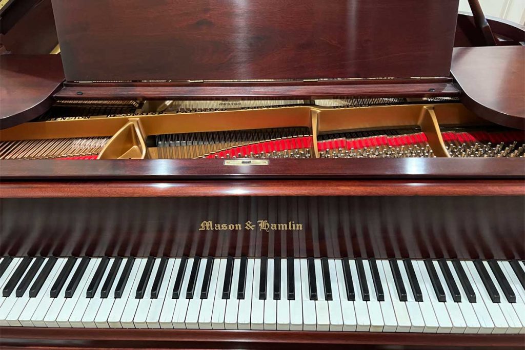 Iva's fully restored Mason and Hamlin Model A grand piano in her home