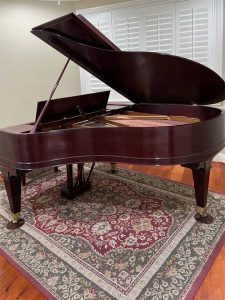 Iva's fully restored Mason and Hamlin Model A grand piano in her home