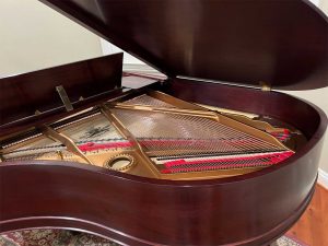 Iva's fully restored Mason and Hamlin Model A grand piano in her home