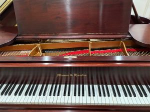 Iva's fully restored Mason and Hamlin Model A grand piano in her home