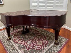 Iva's fully restored Mason and Hamlin Model A grand piano in her home