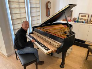 Kevin Barlia with his restored 1969 Steinway M piano