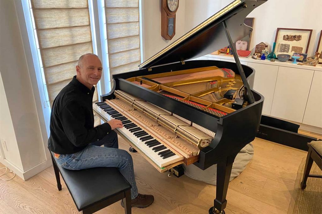 Kevin Barlia with his restored 1969 Steinway M piano
