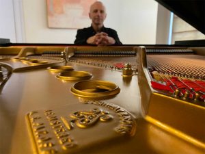 Kevin Barlia with his restored 1969 Steinway M piano