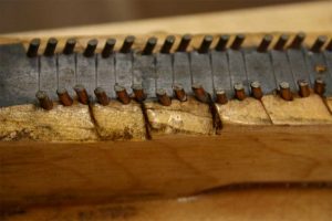 Defective bridge notching to be fixed during piano restoration