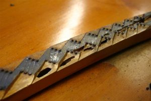 Piano bridge with termite damage