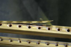 Defective and damaged Steinway and Sons piano patented Tubular Metallic Action Frame Rail requiring replacement