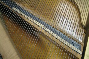 Defective bridge notching to be fixed during piano restoration