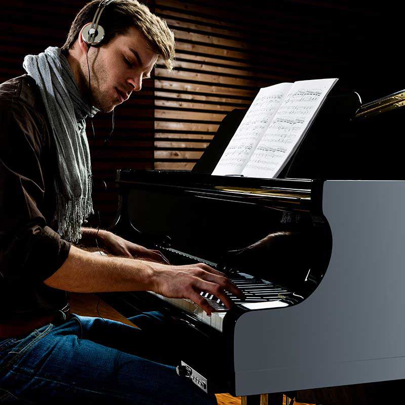 Pianist playing and recording music with PianoDisc ProRecord