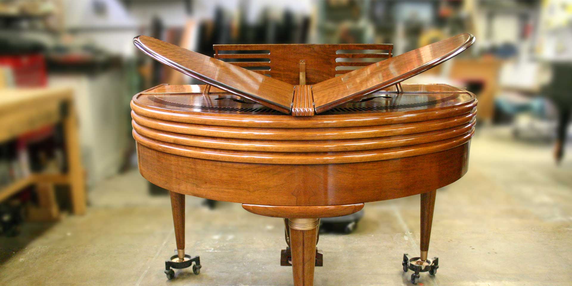 A restored rare vintage 1938 Wurlitzer Butterfly baby grand piano