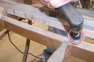 Filing piano capo bar to restore grand piano