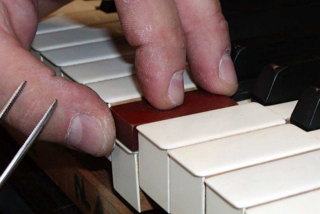 Measuring and adjusting piano key dip to restore a piano